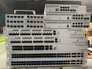 A stack of Mikrotik switches