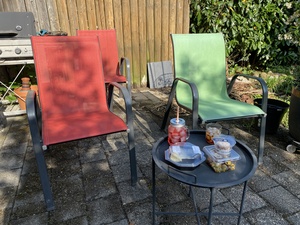 Our backyard chairs beckon for an ap&eacute;ro
