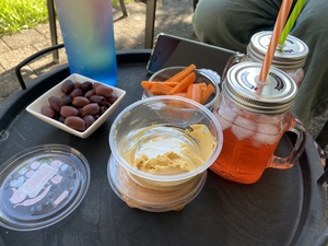 We have an apero in the back yard with gin and tonic, kalamata olives and carrots with humus. It was delish!