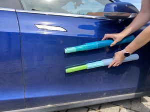 We randomly try a few hues of green and blue and purple against the (blue) car, to figure out which color contrasts well with it.