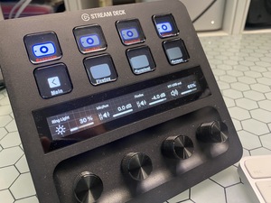 The streamdeck with a first set of buttons and dials. The red labels are 'with camera', the other ones without. The dials control volume, ringlights, and so on. It's really a nice system.