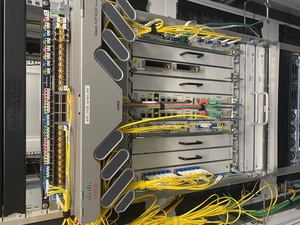 Then, I install the Arista, hook it up to some WDM channels to datacenter #2 and to the ASR9010 below. Later, these will become 100G ports (optics are underway)