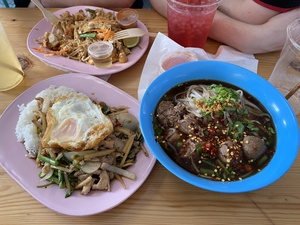 We order and nom on a spicy noodle soup, mie and fried rice