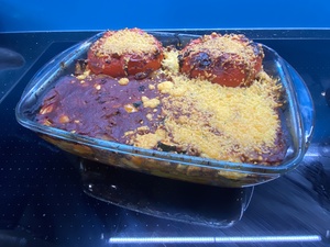 The finished product: 3 stuffed bellpeppers. Oone is buried,and  some have grated cheese (I am not a fan)