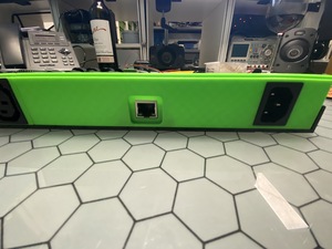 One side of the box will be green, the other red. This is to signify that there are two 220V C13 inputs each with their own 8 C14 plugs on the front.