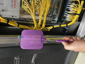 The purple fly swatter is my new favorite tool for datacenters. It sllows me to guide fibers in tight spaces.