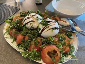 The starter tonight is a beautiful buratta with beefy tomatoes and peppery rocket salad