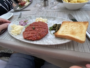 Dinner - Beef Tartar, with toast, egg and red onion.