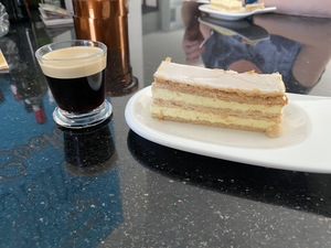 Some energy and relief is given by this nice cup of espresso and creme schnitt.
