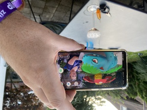 Marina is hanging out with a Venusaur pokemon, but for the moment he's friendly.