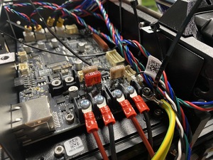 The electronics part of the Prusa MK4S showing its xBuddy board and lots of wires for sensors and stepper motors.