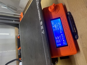 The MK3 case is retrofitted, the Raspberry Pi is installed and the display helpfully shows 'PrusaLink' is being started.
