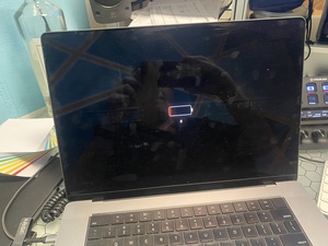 The corp laptop is completely dead. Also, its screen is gross, so I clean it up while it charges. I then send Phreak an e-mail.