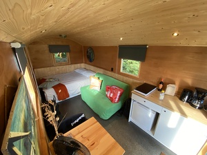 The inside of our green and cozy Pipowagen in Jubbega, Friesland