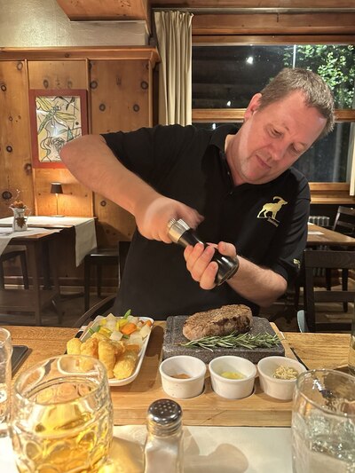 Fred took a candid camera shot of me seasoning my steak. I'm in a happy place, clearly