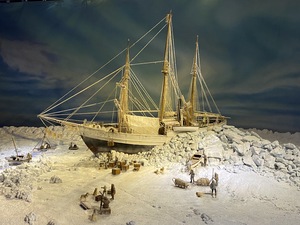 A maquette of the Fram captured in ice, floating along the ocean currents in the artic
