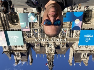 A selfie in front of H&ocirc;tel de Ville in Paris, France. It's plastered full of Paris 2024 olympic signage, which I think is unfortunate.