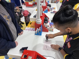 Tim's passport is stamped - twice - by the LEGO store guy in Wallisellen, Switzerland.