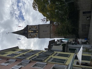 A picture of Sankt Peter church with a very large clockface. I think they're compensating