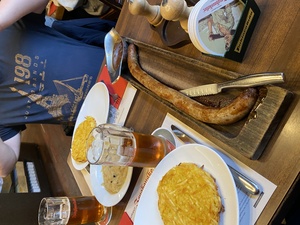 Our meal is a Kanonenputzer, which is a 500mm long pork sausage with mustard. As a side, we have r&ouml;sti and sauerkraut.