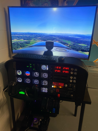 A picture of the FlightSim in its final spot (where it was before Tim and I made it actually work); seen here my Cessna 172 Skyhawk on autopilot