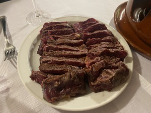 The beef comes pre-bbq'd and sliced, ready to finish cooking on the hot plate at the table.