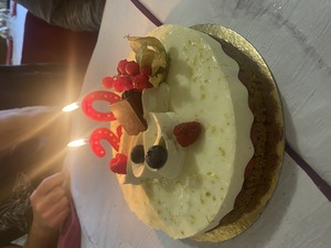 Anastasia arranged a birthday cake, it's a raspberry cheesecake. One of my favorites!