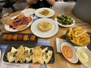 Our tapas at the airport is delicious, and we thoroughly enjoy it, albeit quickly