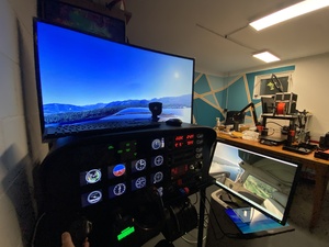 The MS Flight Simulator with an ad-hoc righthand side window, easier to see the airport when doing righthand patterns. Need another screen :)