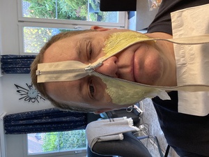 Marina is starting to apply the zipper to my face. The latex stinks (really bad, of ammonia, and it burns the skin We suffer for our art).